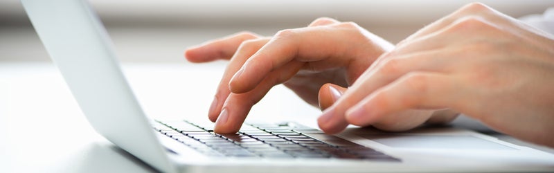 close up of someone using a laptop - Steele GMC Round Rock in ROUND ROCK TX